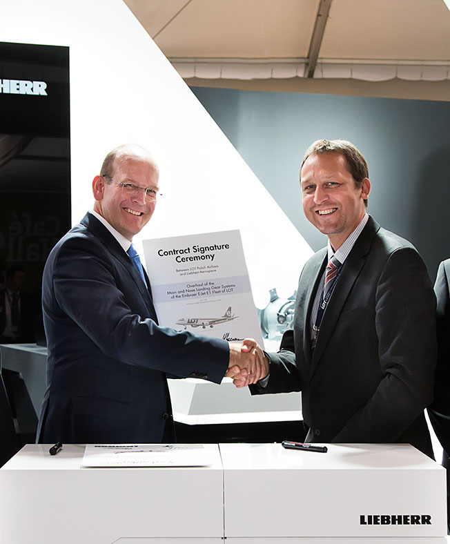 Farnborough International Airshow 2014: Liebherr-Aerospace Signs Contract with LOT Polish Airlines for E-Jet E1 Landing Gear Overhauls