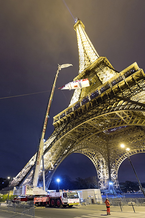 Liebherr LTM 1300-6.2 mobile crane hoists boat onto Eiffel Tower gallery