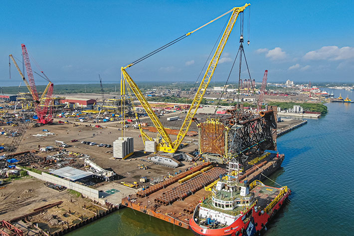 Liebherr LR 13000 crawler crane loads massive oil platform 