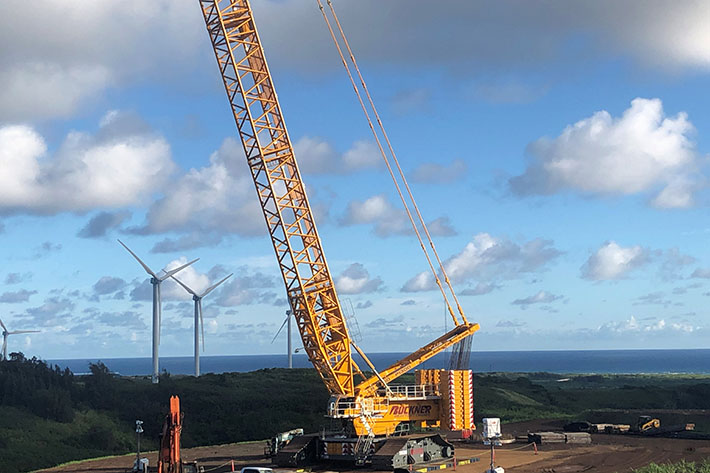 Liebherr crawler crane LR 11000 between Ironman and surfers in Hawaii