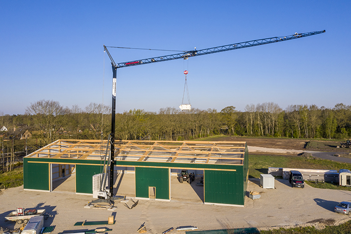 Cranes in black: Three Liebherr L1-32 fast-erecting cranes for Heims Holzbau