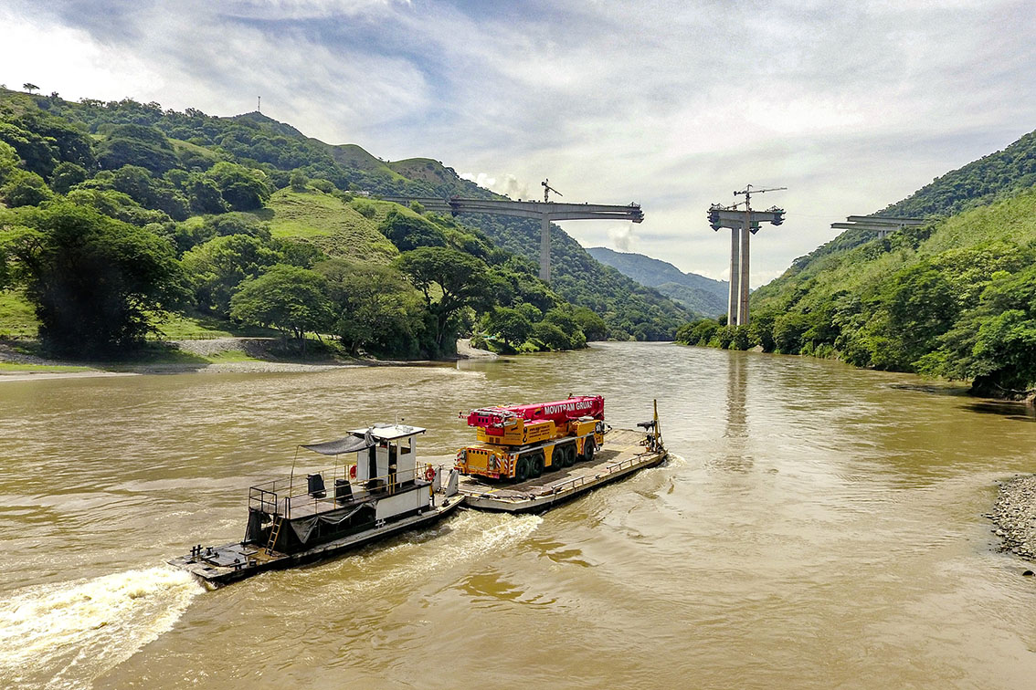 Extraordinary project – Liebherr 5-axle crane floated to site on a barge