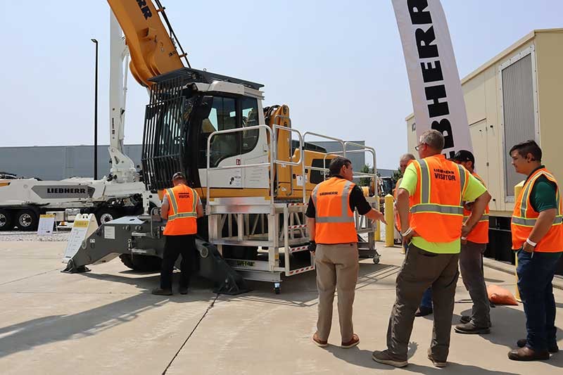 Customers touring the mobile excavator at the Liebherr Equipment Source open house event at the Liebherr USA, Co. Newport News, VA campus.