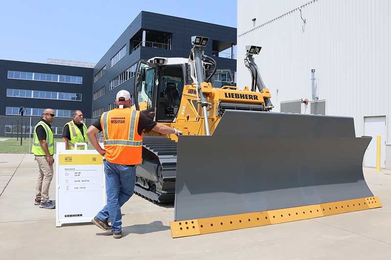 Customers touring  the PR 736 dozer at the Liebherr Equipment Source open house event at the Liebherr USA, Co. Newport News, VA campus.