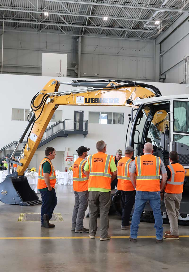 Attendees were able to participate in multiple machine walkarounds in Liebherr’s state-of-the-art training bay. Shown here is a Liebherr crawler excavator.