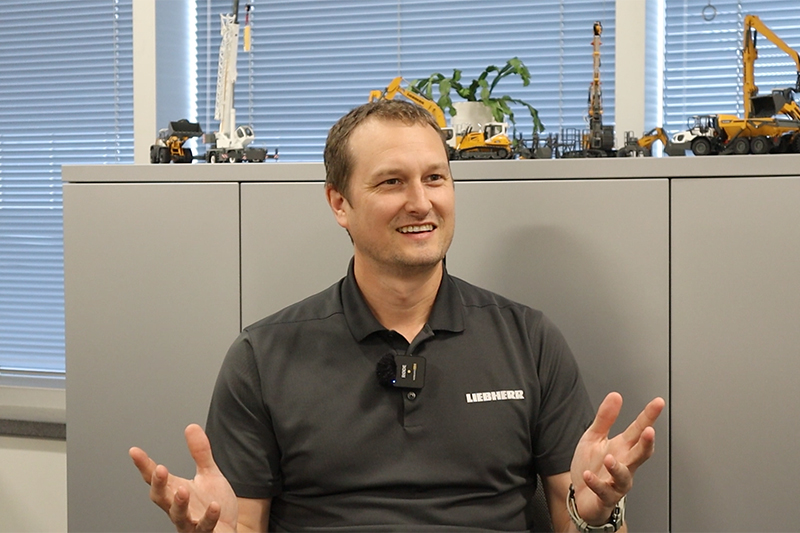 Liebherr employees welcome visitors to Conexpo 2026