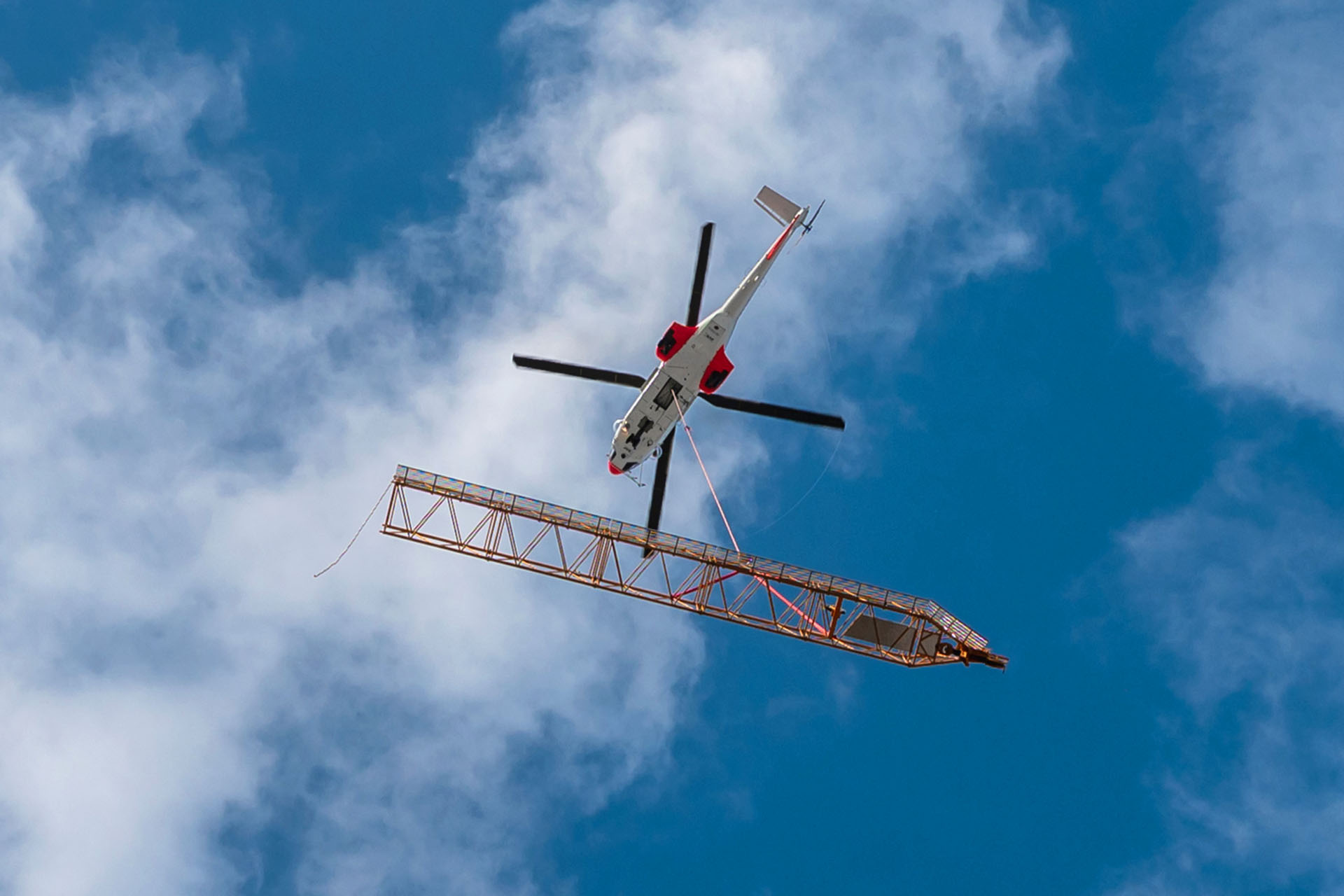 Liebherr overcomes access restrictions to lift a Derrick crane onto a Paris high-rise roof