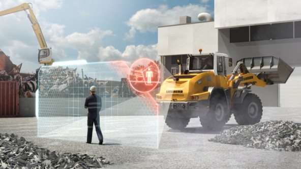The active personnel detection system monitors the rear area of the wheel loader and automatically warns the operator of dangers