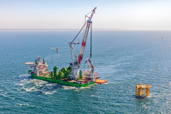 A picture of an offshore crane in the middle of the ocean by Liebherr