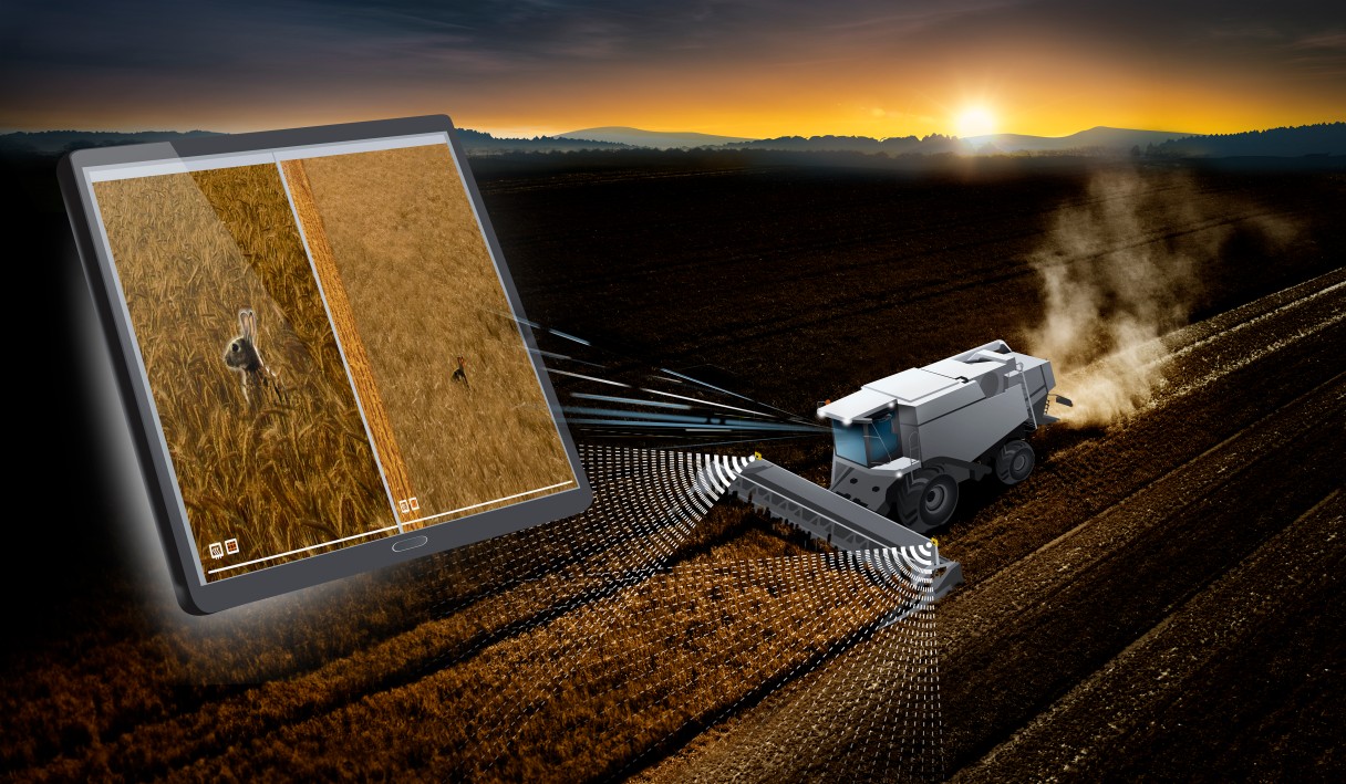 A tractor scans the field, efficiently examining the agricultural land for possible cultivation.