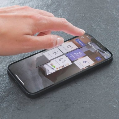 Hand hovering over mobile phone with screen showing SmartDevice app