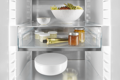 Open door fridge organised with a drawer 