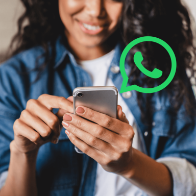 Girl on her phone using whatsapp with the icon on the image