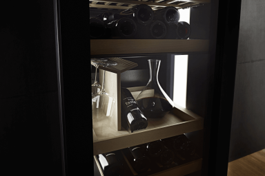 Wine fridge with a wine decanter, bottle with glasses 