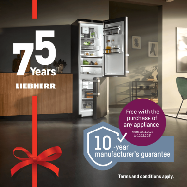 a close up of an open door fridge freezer with red ribbon and 75 years icon to the side to celebrate an offer