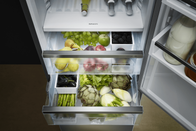 Close up of an open drawer with organised fruit and vegetables 