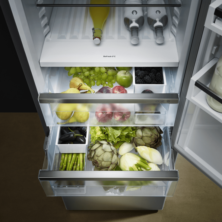 Drawers pulled out in a Liebherr fridge with fruit and vegetables organised with a FlexSystem