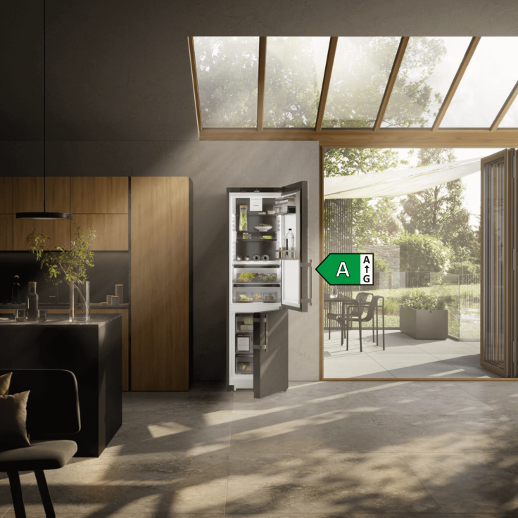 Open door fridge freezer with an A rated icon at the side in a modern kitchen