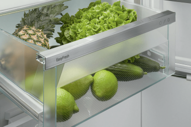 Close up of a pulled out Easyfresh drawer with vegetables inside