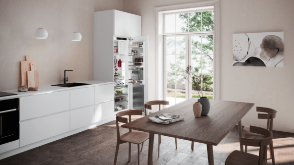 Liebherr IRBAd 5171 peak BioFresh Professional integrated fridge with AutoDoor, a cellar compartment, set within a modern kitchen. The open door reveals fresh, well-organised food inside