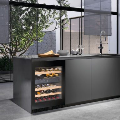 Integrated wine fridge in a dark modern kitchen