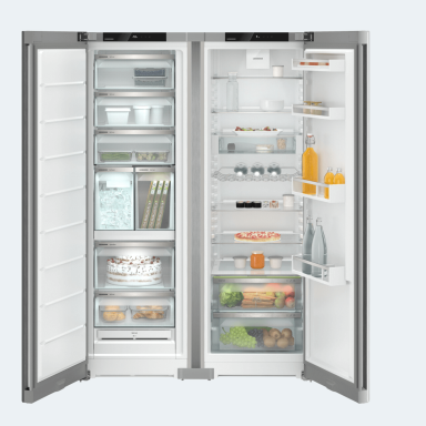 Large Liebherr fridge and freezer side by side filled with food and drinks