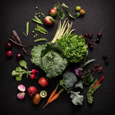 Scattered vegetables on a black surface