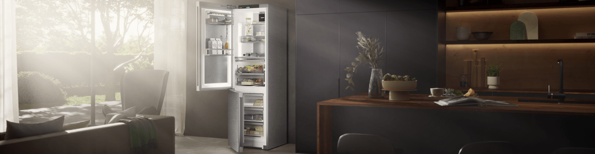 Modern dark kitchen with n open door fridge freezer