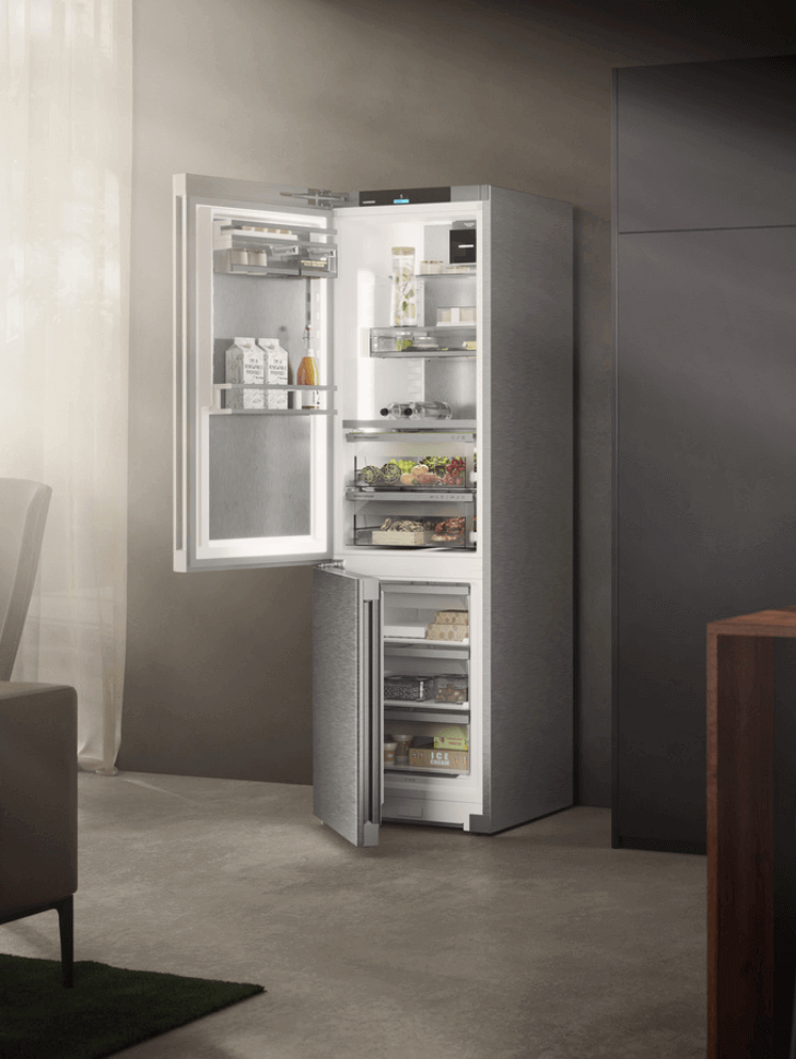 Close up of a fridge freezer with sunlight shining on the appliance