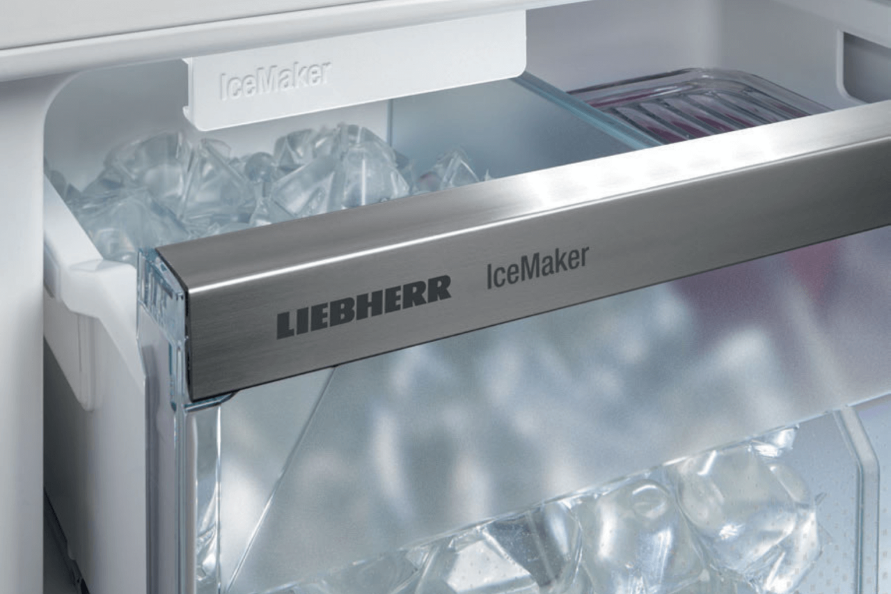 Closeup of a Liebherr IceMaker with the draw open showing ice cubes