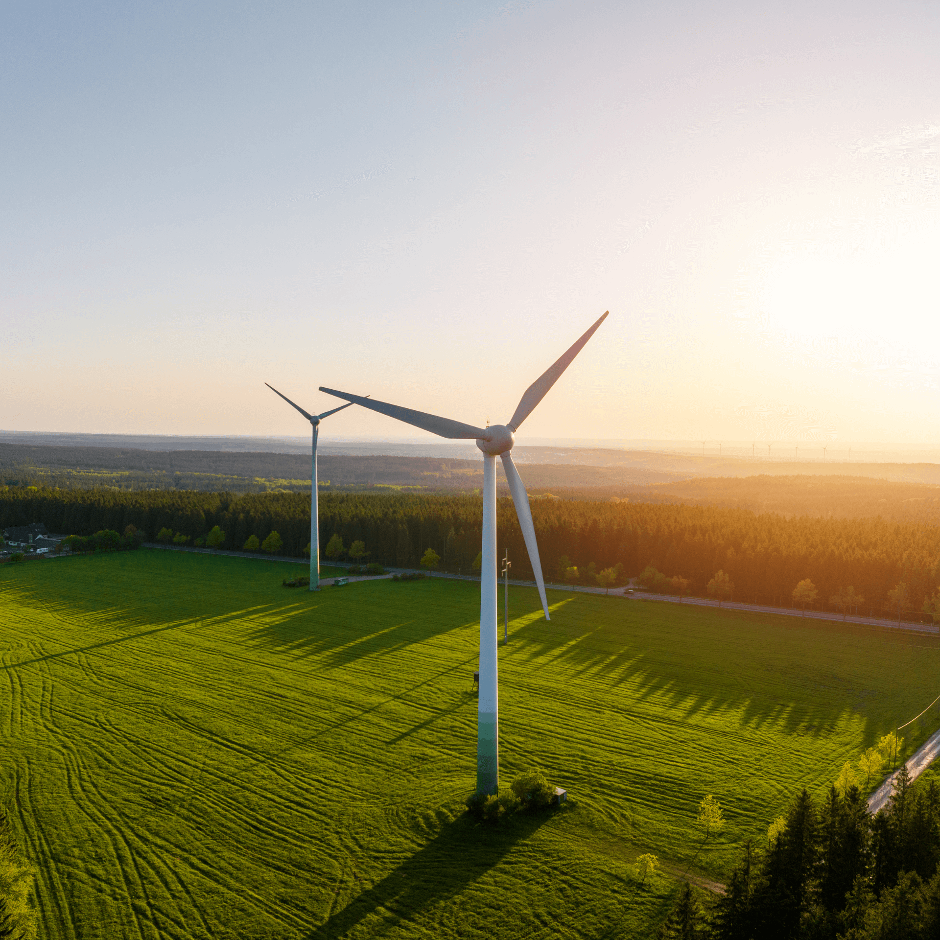 Wind turbines with a sunset in the background