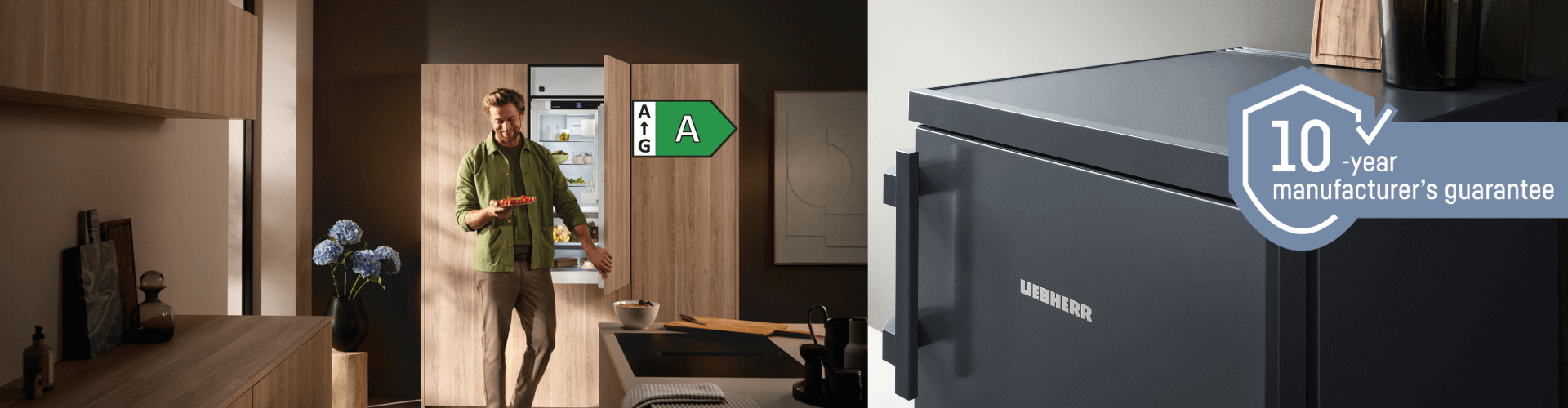 Dual image showing: left – an open-door integrated fridge with a man standing in front holding a palette of strawberries, with an A-rated green energy icon beside the door; right – a close-up of a DarkGrey under-counter appliance.Featuring the 10-year guarantee icon.