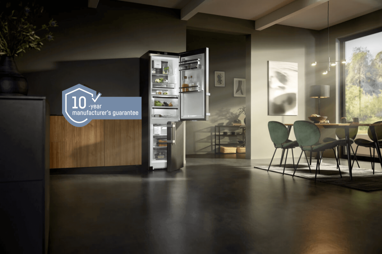 freestanding fridge freezer with open doors and a 10 year guarantee icon