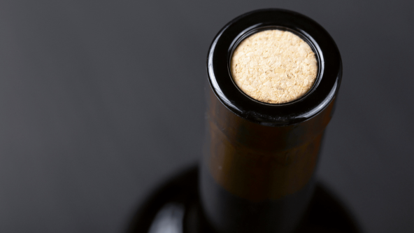 Wine bottle cork Close-up view of a wine bottle cork, highlighting freshness and preservation.