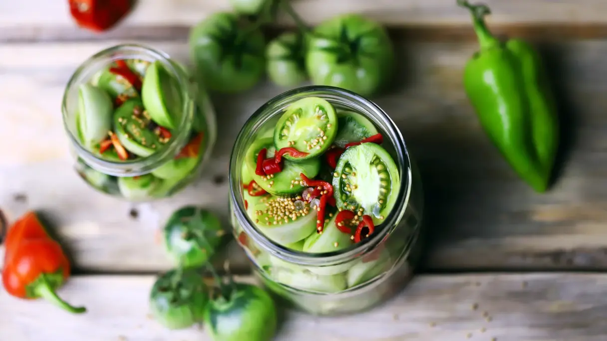 What effect do fermentation and maturation have on flavour? Tomatoes and peppers arranged in a glass as a salad.