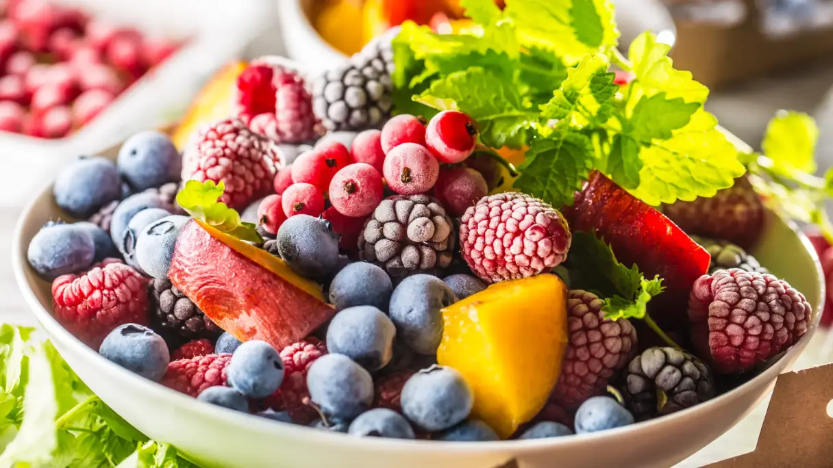 Frozen fruit Bowl with berries, fruit, and fresh mint.