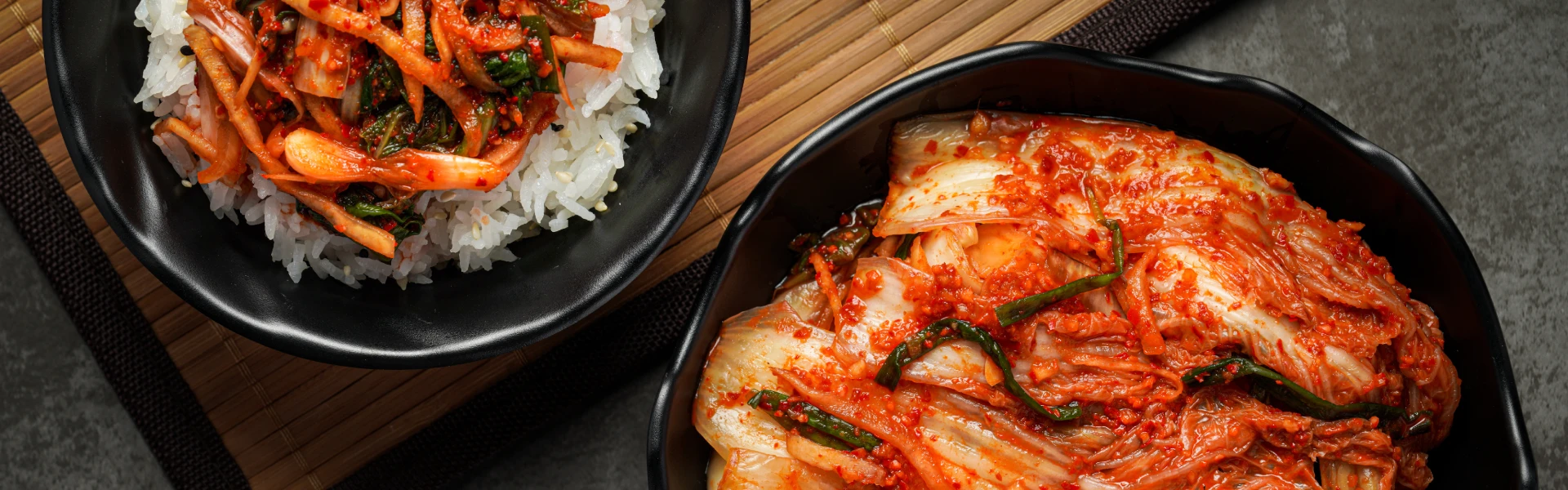 Kimchi Kimchi served in a black bowl.