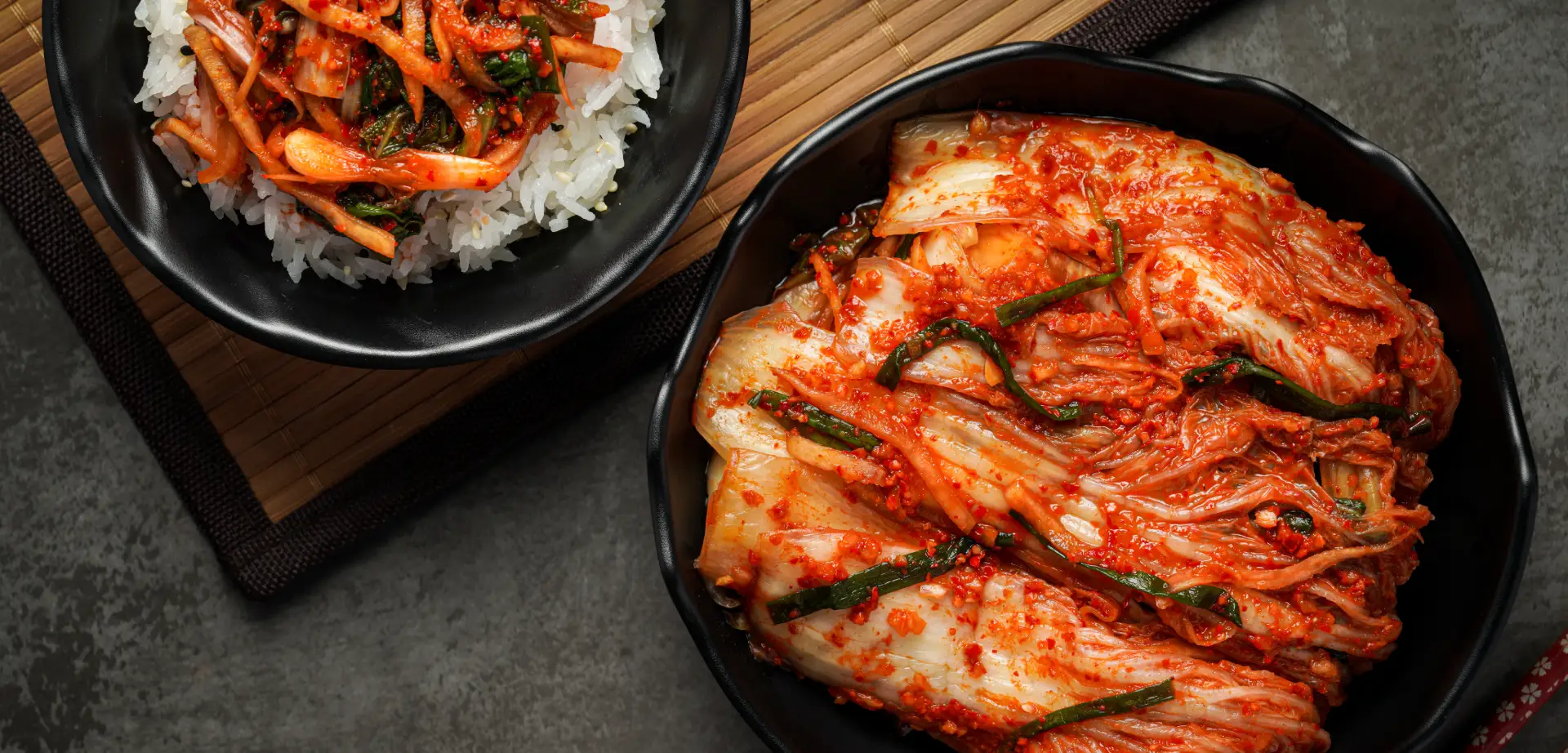 Kimchi Kimchi served in a black bowl.