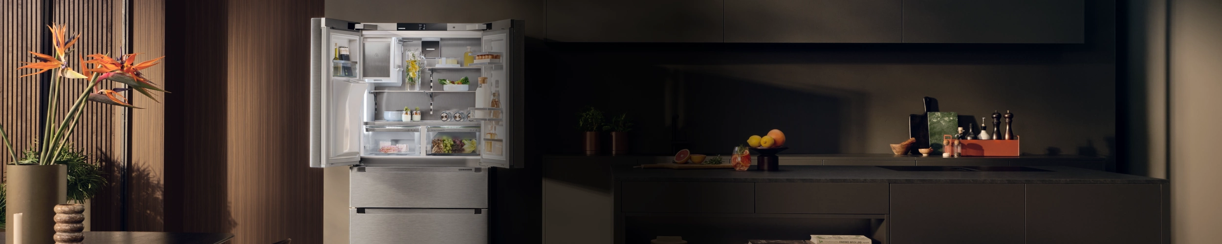 Open French Door fridge with IceMaker in modern kitchen setting