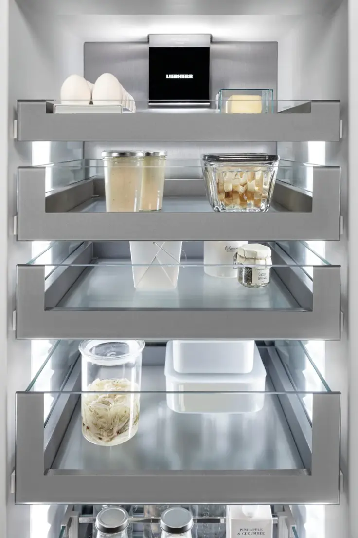 Fully integrated fridge with OpenStage glass shelves filled with foods and drinks