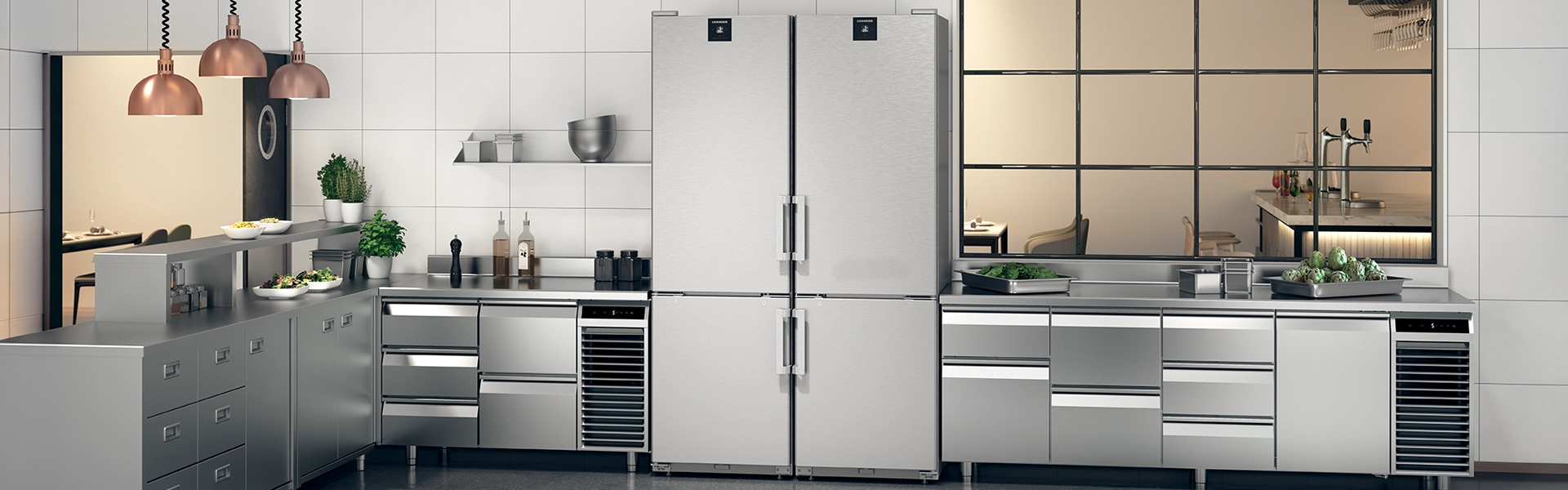 TCO: Commercial kitchen with stainless steel fridges Modern commercial kitchen with two tall stainless steel fridges, stainless steel worktops and herb pots.