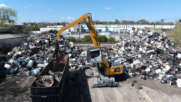 Liebherr USA, Co. LH 40 M material handling machine with grapple sorting scrap at the RIMCO scrap yard in St. Louis. Image of a Liebherr USA, Co. LH 40 M material handling machine with grapple sorting scrap at the RIMCO scrap yard in St. Louis.