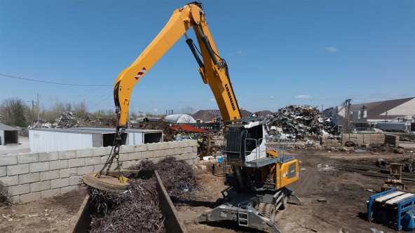 Liebherr USA, Co. LH 40 M material handler with magnet working with scrap metal at the RIMCO scrap yard in St. Louis. Image of a Liebherr USA, Co. LH 40 M material handler with magnet working with scrap metal at the RIMCO scrap yard in St. Louis.
