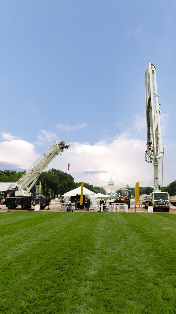 Liebherr USA, Co. tent exhibit at Construction on the National Mall. Exhibits include an LRT 1090-2.1 rough terrain crane, 42 XXT concrete pump truck, L 546 wheel loader. Image of Liebherr USA, Co. tent exhibit at Construction on the National Mall. Exhibits include an LRT 1090-2.1 rough terrain crane, 42 XXT concrete pump truck, L 546 wheel loader.