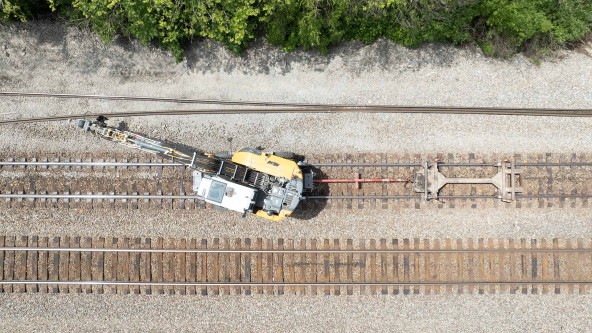 Image of Omaha Track, Inc. using the Liebherr A 924 rail excavator to perform railroad infrastructure  reclamation, abandoned track removal, new construction, track expansion, track maintenance, track inspections, and track repair on the Norfolk Southern railroad line.