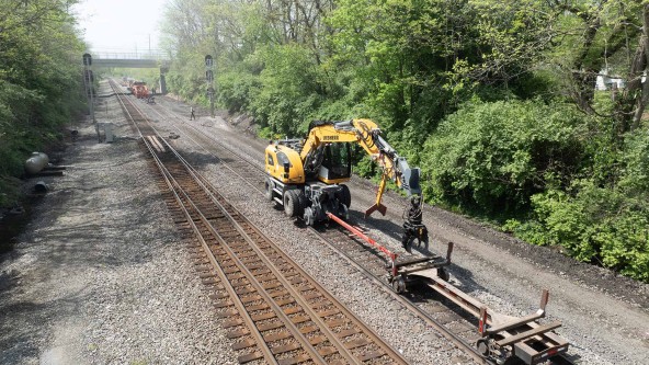 Omaha Track, Inc. using the Liebherr A 924 rail excavator to perform railroad infrastructure  reclamation, abandoned track removal, new construction, track expansion, track maintenance, track inspections, and track repair on the Norfolk Southern railroad line.