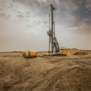 Liebherr LB 24 drill rig and 110 D concrete crawler pump working in Abu Dhabi