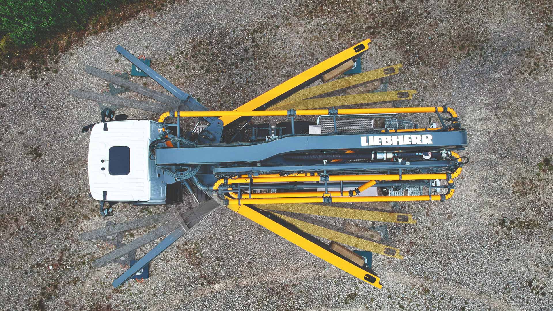 Liebherr USA, Co. 36XXT concrete pump truck showing XXA stability control system Liebherr USA, Co. 36XXT concrete pump truck showing XXA stability control system