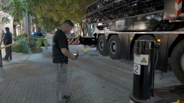 Mobile crane operator outside of cab