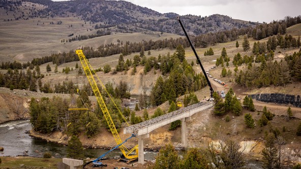 Liebherr mobile cranes execute controlled lifts during Yellowstone River Bridge demolition, supporting safe operations across rugged terrain and active waterways. Liebherr mobile cranes execute controlled lifts during Yellowstone River Bridge demolition, supporting safe operations across rugged terrain and active waterways.